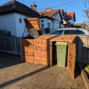 Wooden triple wheelie bin storage unit with individual lids, suitable for three standard bins.