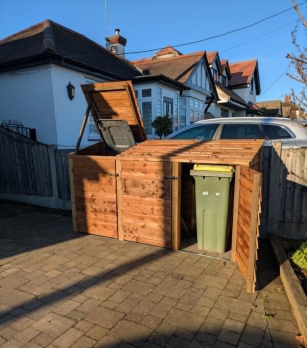 Wooden triple wheelie bin storage unit with individual lids, suitable for three standard bins.